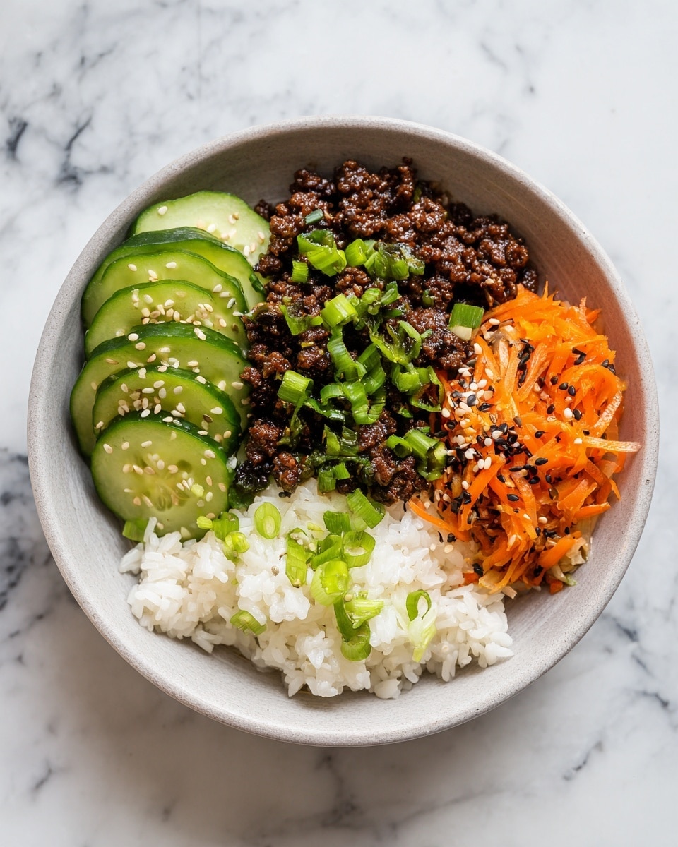 The image shows a white bowl with a layered dish. The base layer is white rice with a soft, fluffy texture. On top, there is a dark brown seasoned beef mixture scattered evenly across the rice, with small pieces of peanuts and green sliced spring onions spread over the beef. To one side, there is a small pile of thinly shredded bright orange carrots. On the other side, there are round slices of fresh cucumber, some with a drizzle of red sauce. The bowl sits on a white marbled surface, and a woman's hand is holding a white spoon above the bowl. Photo taken with an iphone --ar 4:5 --v 7