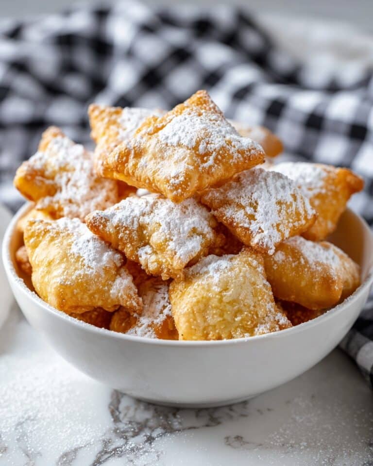 Homemade Beignets: Soft, Pillowy Fried Pastries Dustéd in Powdered Sugar Recipe