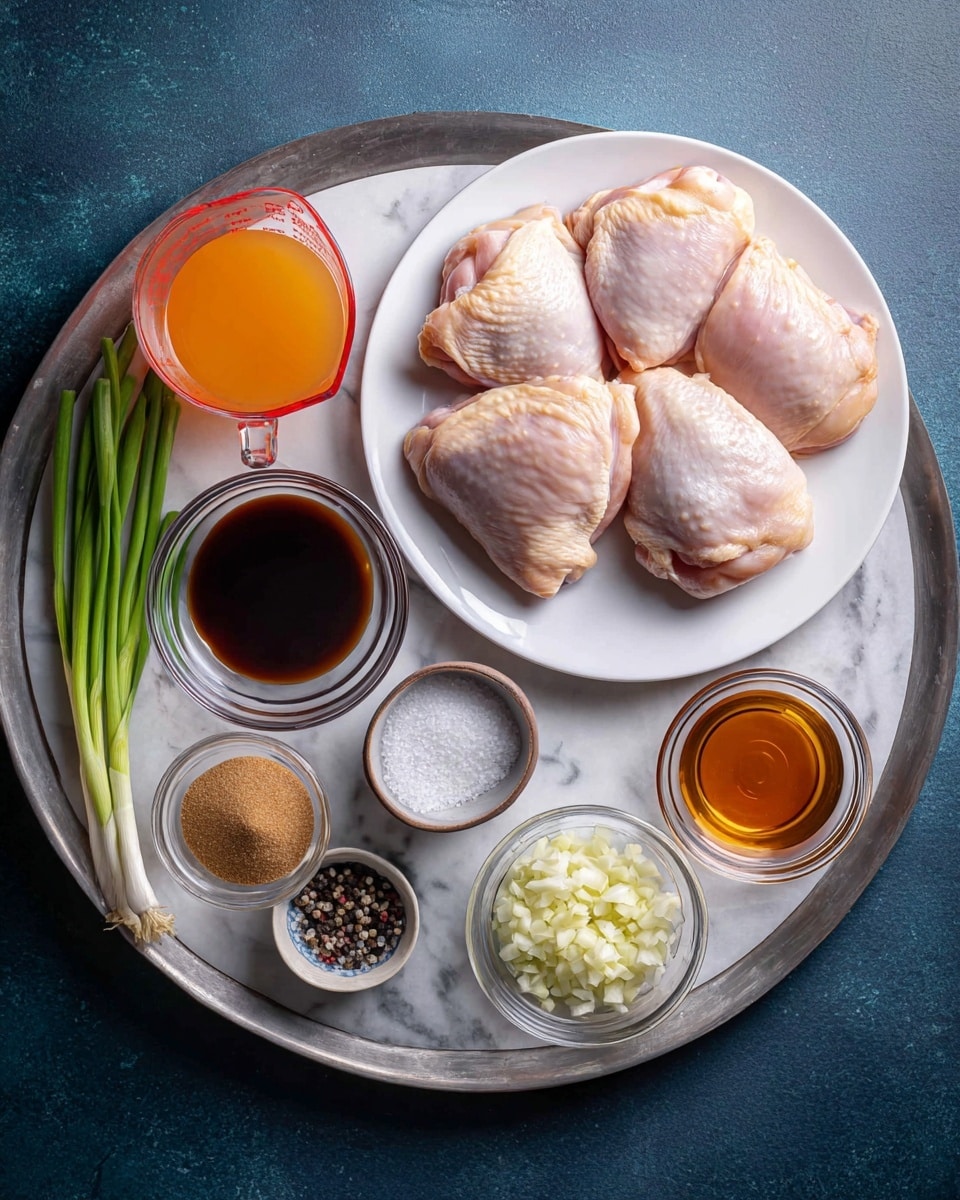The image shows various cooking ingredients arranged neatly on a white marbled surface. There is a white round plate on the right holding four raw chicken thighs with light pink skin. On a metallic tray, several small clear glass bowls hold different ingredients: a bright orange liquid in a measuring cup on the left, a dark brown sauce in a bowl at the top center, a small bowl with light brown sugar below that, and a bowl with a light amber liquid on the right of the sugar. Two bowls on the right side hold finely chopped pale yellow and white garlic or ginger. At the top left corner, three green onions rest diagonally across the tray. There is also a small white bowl on the tray containing a mix of white salt and black pepper. The overall setting is clean and organized, with a dark blue background outside the metallic tray. Photo taken with an iphone --ar 4:5 --v 7