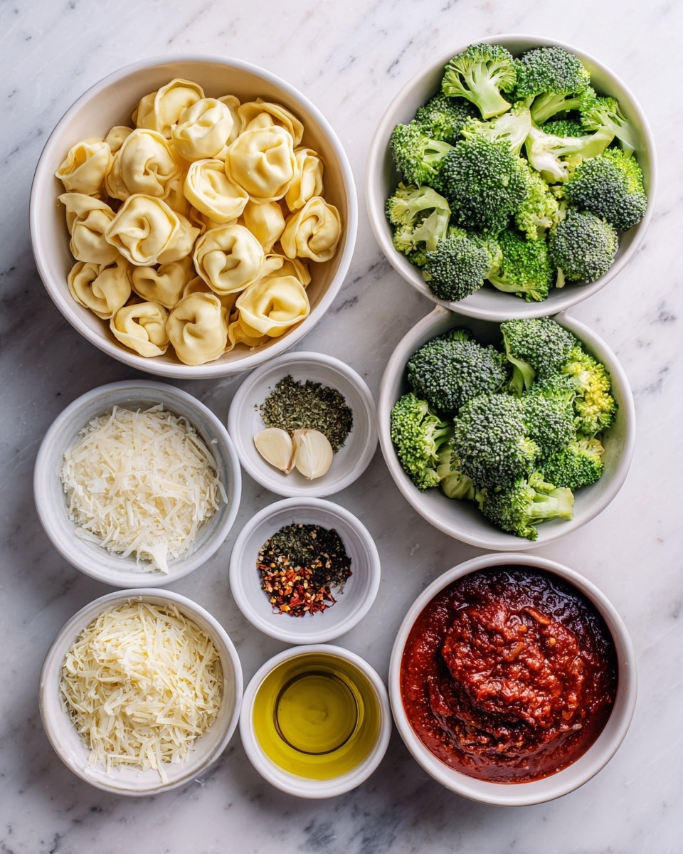 The image shows a white marble surface with separate white bowls containing different ingredients arranged neatly. There is a bowl of light yellow tortellini pasta in the top left and a bowl of bright green broccoli florets in the top right. Below them are small white bowls filled with golden olive oil, small chopped pale garlic pieces, dark pepper, and reddish chili flakes. White bowls at the bottom hold white salt, finely chopped herbs, pale shredded cheese, and a larger bowl of rich red tomato sauce, along with another bowl of shredded cheese and more chili flakes. The arrangement is clean and organized, with each ingredient's color and texture clear. Photo taken with an iphone --ar 4:5 --v 7