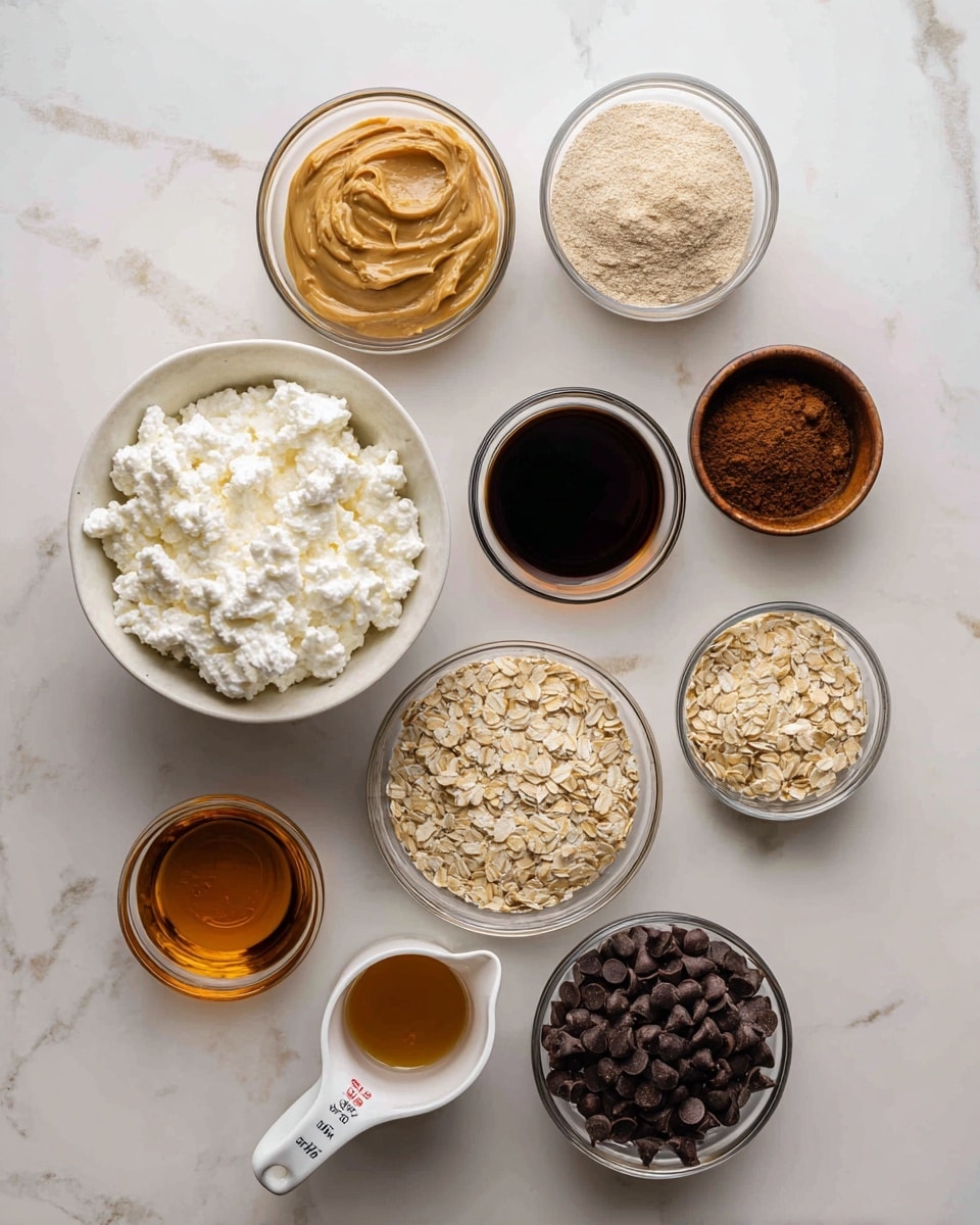 The image shows nine bowls and a container arranged on a white marbled surface, each holding different ingredients. There is one large white container filled with creamy white cottage cheese positioned slightly tilted in the center. Surrounding it are clear glass bowls containing light brown peanut butter, beige protein powder, golden rolled oats, dark brown cocoa powder, and white coconut oil. There is a small brown bowl with dark amber vanilla liquid and a white measuring cup with dark amber maple syrup. Another clear bowl contains small, glossy dark brown chocolate chips. Photo taken with an iphone --ar 4:5 --v 7