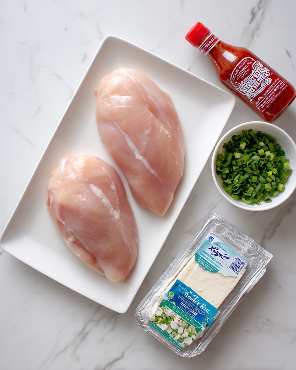 The image shows two large raw chicken breasts placed on a white rectangular plate with a smooth surface. To the right of the plate is a bottle of sweet chili sauce with a red label and cap. Below the chicken is a blue and green packet of ranch dressing mix lying flat on the white marbled background. Near the bottom right corner, a silver rectangular block of cream cheese with blue and white packaging sits unopened. Above the cream cheese, there is a small white bowl filled with chopped green onions that are vibrant and fresh. The whole setup is arranged neatly on a white marbled surface. Photo taken with an iphone --ar 4:5 --v 7