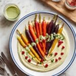 Whole Roasted Rainbow Carrots Over Creamy Hummus with Green Tahini Sauce Recipe