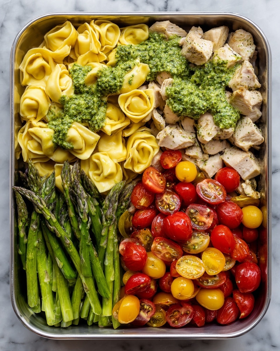 A round black tray holds five distinct sections of food arranged in neat groups on a white marbled surface. Starting from the top left, there is a cluster of pale yellow tortellini with a soft, smooth texture. Next to it on the top middle, there is a pile of dark red sun-dried tomatoes with a wrinkled, dense look. On the top right, bright yellow cherry tomatoes are sliced in half, showing their fresh juicy interiors. Below them on the bottom right, red cherry tomatoes also sliced in half are placed, vibrant and shiny. On the bottom left, green asparagus spears are laid out in a neat row, their tips pointed outward, showing a fresh and slightly glossy texture. The tray is photographed from above, photo taken with an iphone --ar 4:5 --v 7
