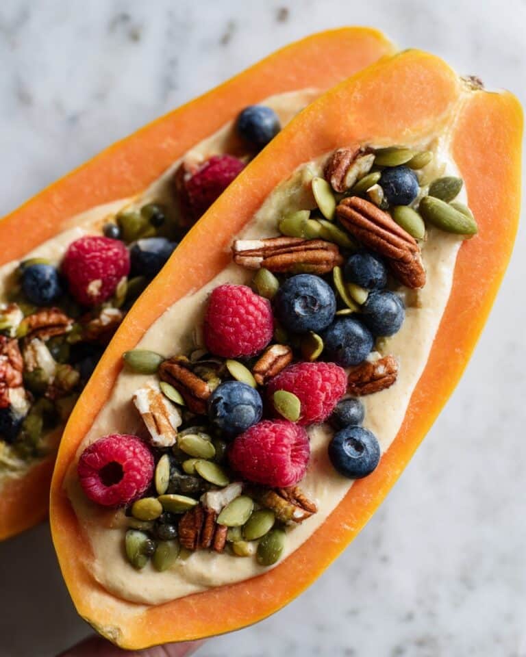 Loaded Papaya Breakfast Bowl with Greek Yogurt, Berries, Granola, and Nut Butter Recipe