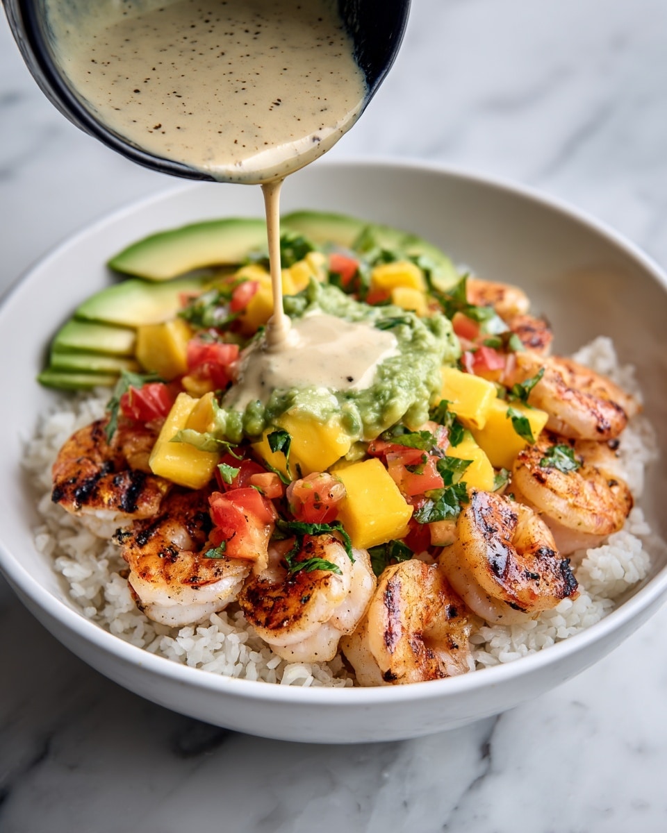 A white bowl on a white marbled surface holds a colorful dish with three main sections. In the front layer, there are bright orange grilled shrimp with dark char marks, garnished with small green herb pieces. To the left, there are thin, curved slices of ripe green avocado arranged in a fan shape. On the right side, there is a mix of small diced yellow and red vegetables with green herbs. A creamy beige sauce with specks and green herbs is being poured from a black spoon over the shrimp, creating a glossy drizzle. Photo taken with an iphone --ar 4:5 --v 7