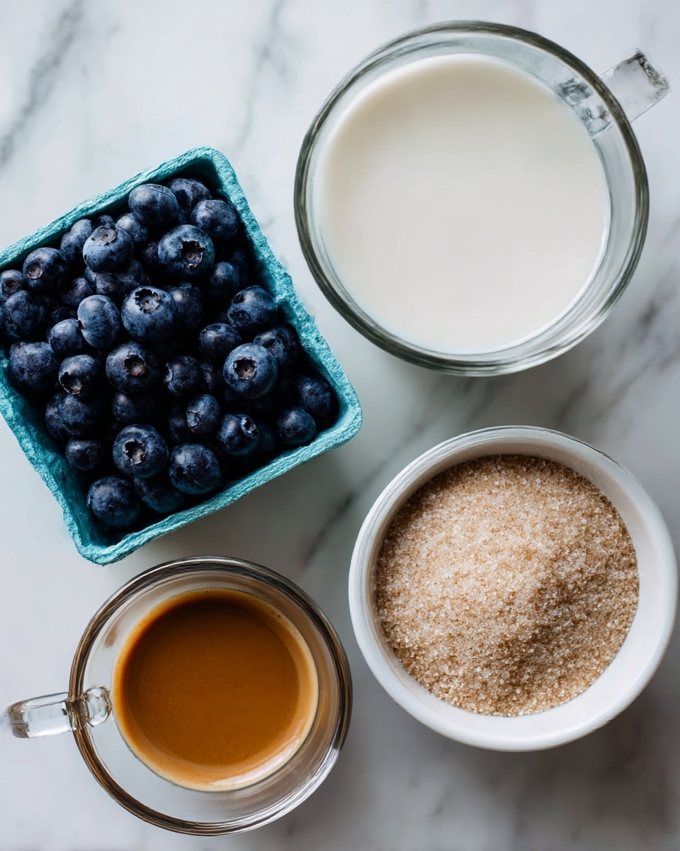 A close-up view of four containers with different ingredients placed on a white marbled surface. In the top left, there is a square light blue carton filled fully with dark blue round blueberries. To the right of the blueberries, there is a clear glass mug filled with white milk. Below the milk and blueberries, there is a small clear glass cup holding brown espresso with a smooth surface. At the bottom right, there is a white bowl filled with off-white cane sugar that has a slightly grainy texture. Photo taken with an iphone --ar 4:5 --v 7