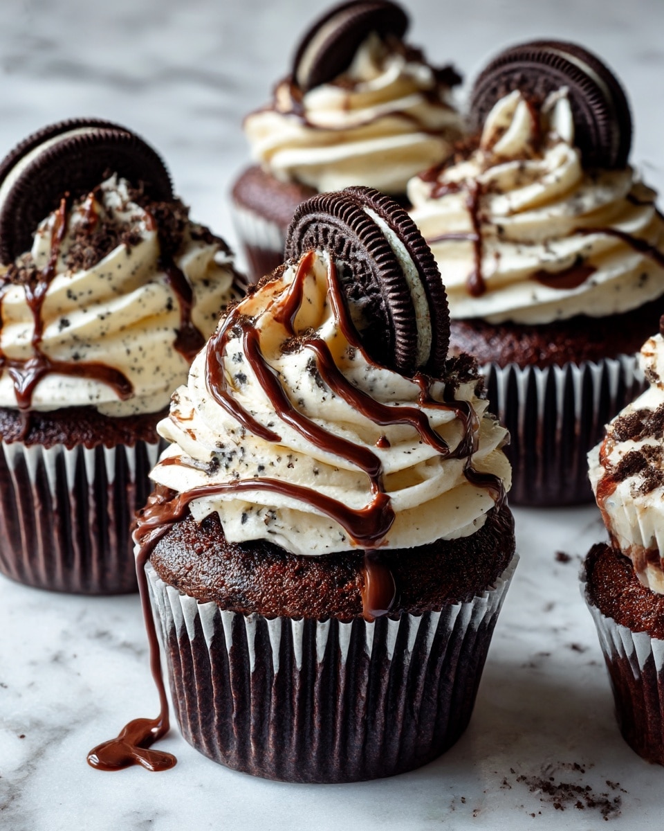 The image shows dark chocolate cupcakes with three main layers. The bottom layer is the dark chocolate cupcake base, wrapped in a dark ridged paper liner. On top of each cupcake is a thick swirl of white cream frosting with small black specks mixed in, giving it a cookies and cream look. Each frosting swirl is decorated with dark chocolate drizzle flowing down in thin lines. A whole dark chocolate sandwich cookie is placed upright, partially embedded on the side of the frosting on each cupcake. The cupcakes are set on a white marbled surface. photo taken with an iphone --ar 4:5 --v 7