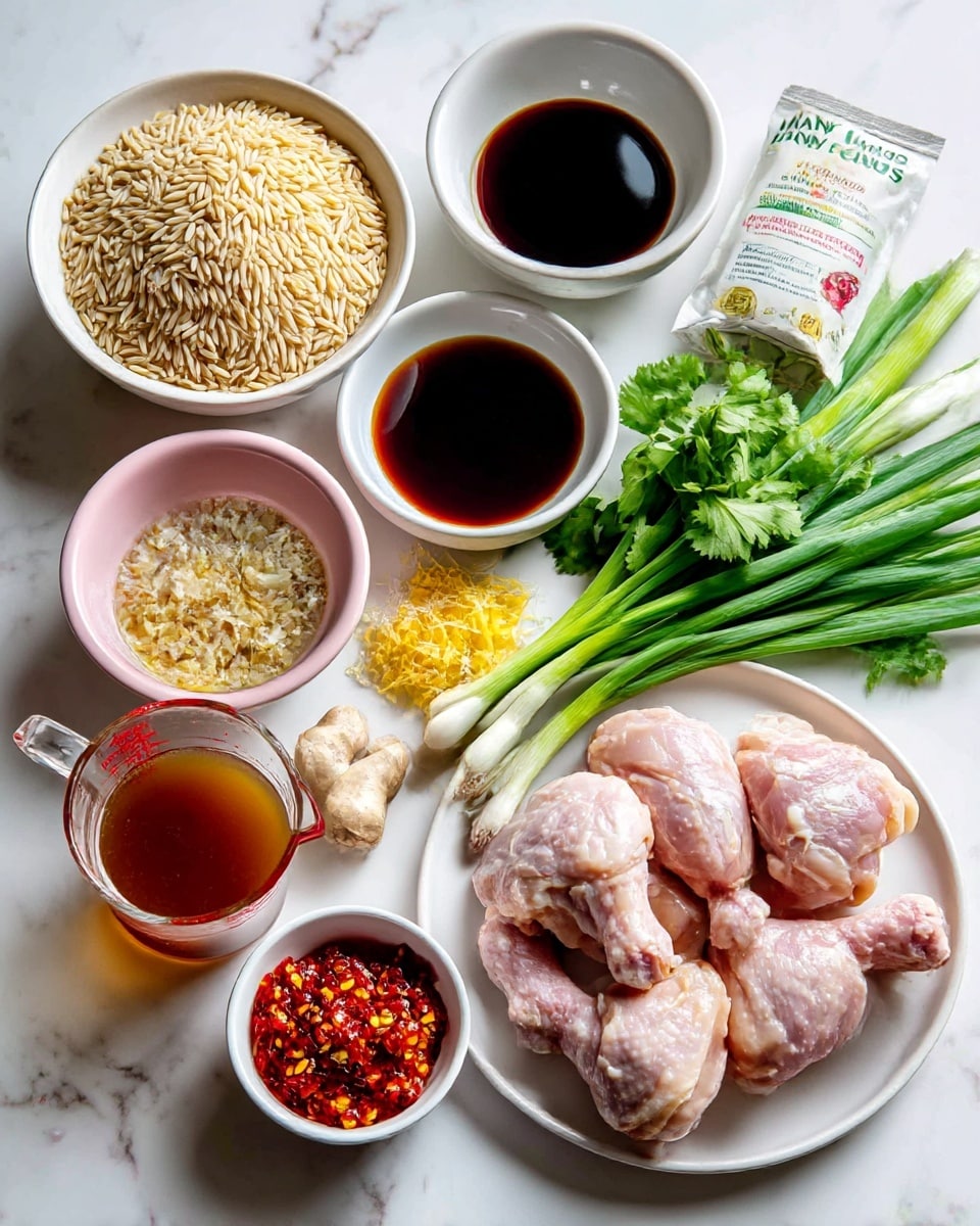The image shows several ingredients arranged on a white marbled surface. At the top left, there is a white bowl filled with light tan orzo grains. Next to it on the right is a white bowl containing dark brown soy sauce. Below the soy sauce, bright green cilantro leaves and green scallions with white bulbs are placed. To the left of the cilantro, a small pink bowl holds minced garlic and shredded pale yellow ginger alongside a few red chili flakes. At the bottom left, a clear measuring cup contains brown chicken stock. In the center bottom section, a white plate holds pale pink raw chicken thighs with visible skin and bones. Next to the chicken, on the right bottom, there is a small white bowl with bright red chili oil. Another small white bowl contains a chunky sweet chili jam with red and yellow tones. The ingredients are orderly arranged to show each item clearly, photo taken with an iphone --ar 4:5 --v 7